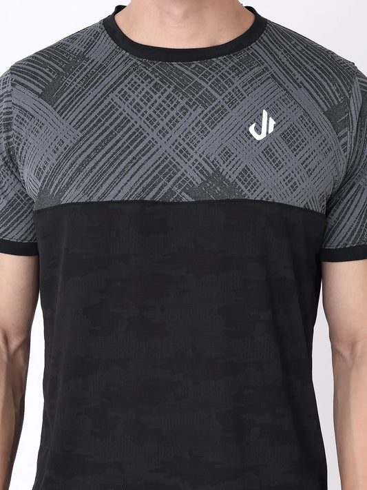 A black and grey camouflage printed t-shirt with a logo on the chest.